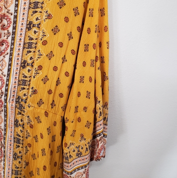 Coco+Jaimeson Large Boho Style Dress with Bell Sleeves and a Handkerchief Hem - Picture 3 of 6